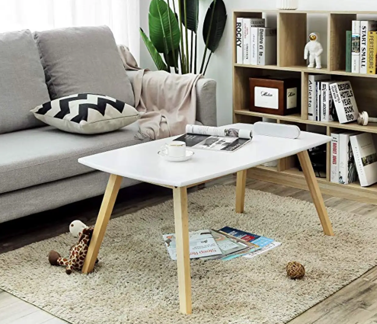 Enter for your chance to win a Songmics Coffee/Cocktail Table. This coffee table is inspired by nature and a love of simplicity. It has clean lines and a simple silhouette. And the white top and light colored solid wood legs means the colors will go with just about any decor.
